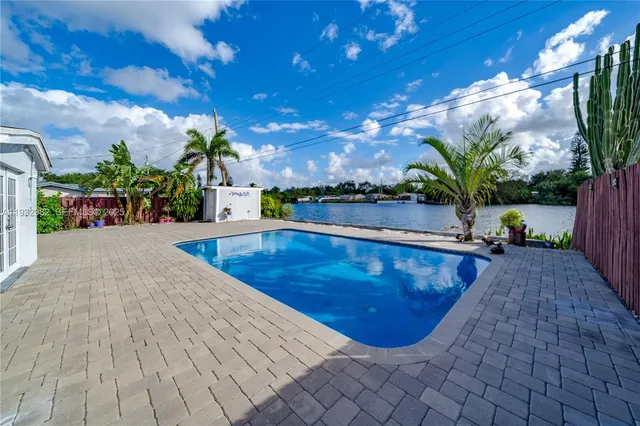 a view of a swimming pool with a patio