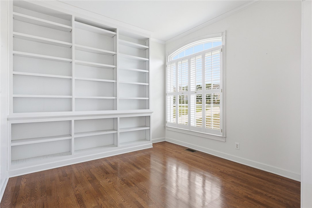 110 Garden Gate Drive Anderson, SC 29621 - Photo 11 of 35 This bright space features built-in shelving and hardwood flooring, offering versatile possibilities.