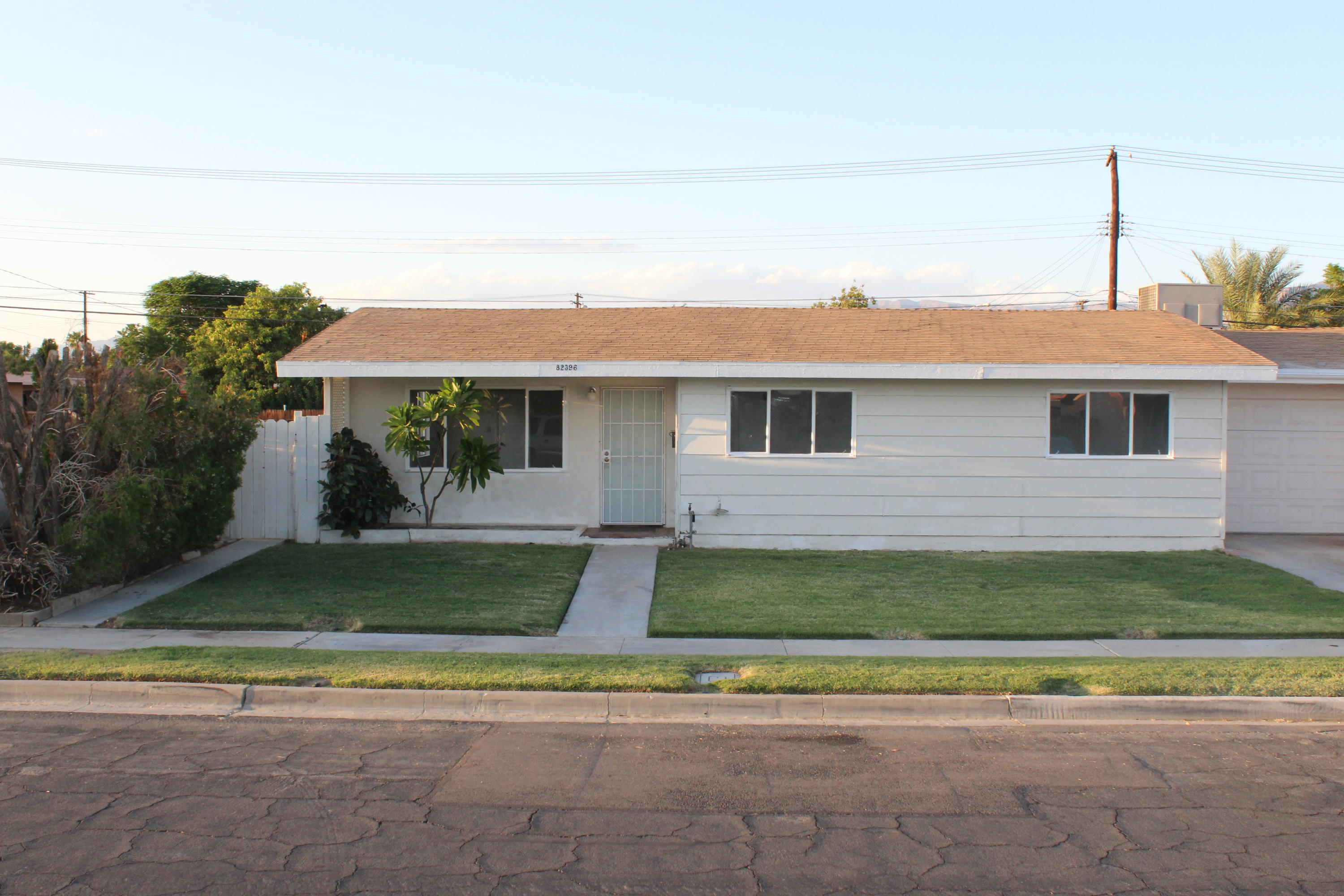 82396 Adobe Road Indio, CA 92201 - Photo 1 of 53 a front view of a house with a yard
