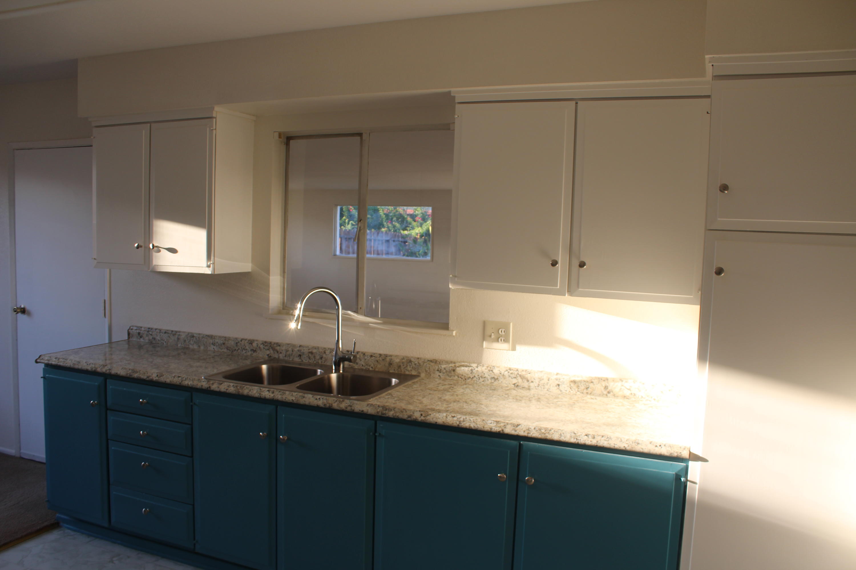 82396 Adobe Road Indio, CA 92201 - Photo 12 of 53 a kitchen with a sink and cabinets