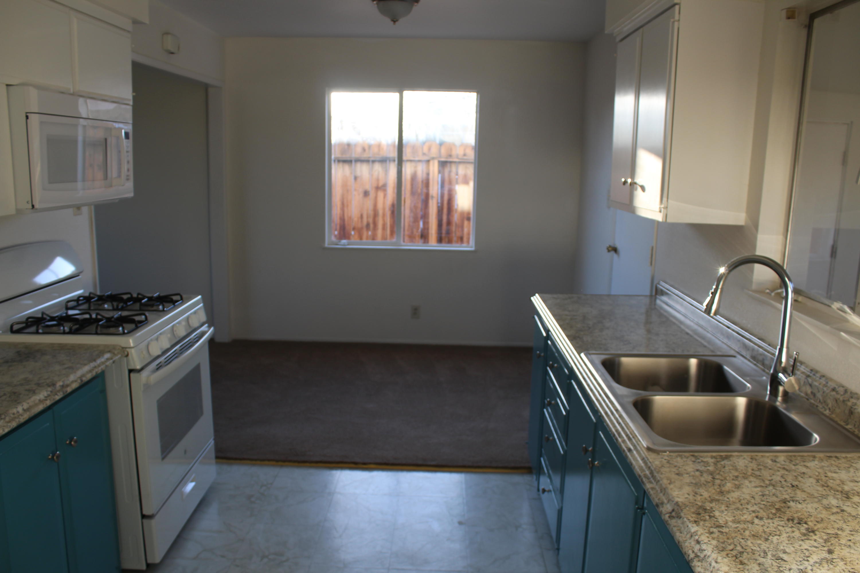 82396 Adobe Road Indio, CA 92201 - Photo 14 of 53 a kitchen with a stove and a sink
