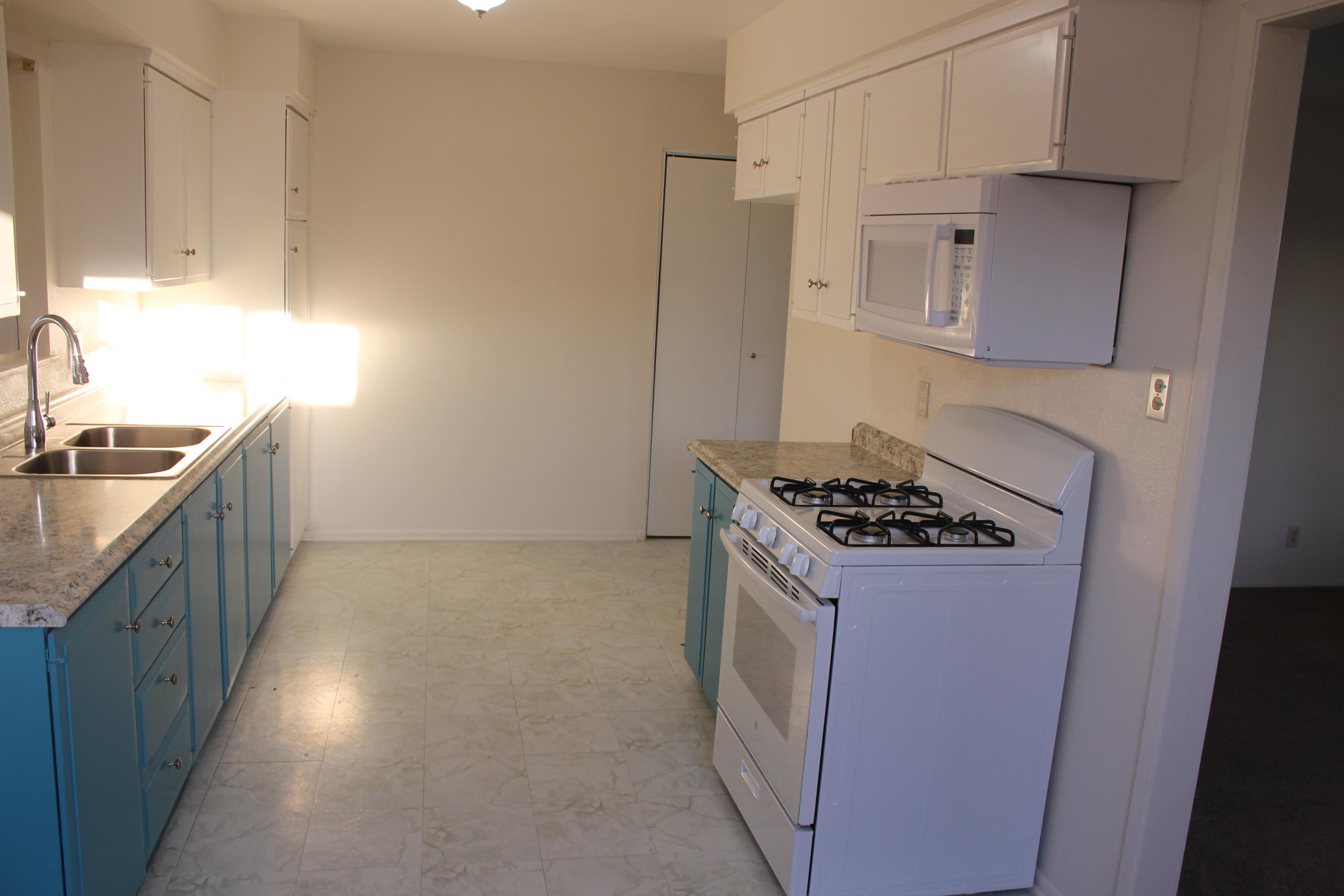 82396 Adobe Road Indio, CA 92201 - Photo 17 of 53 a kitchen with stainless steel appliances granite countertop a stove a sink and a refrigerator