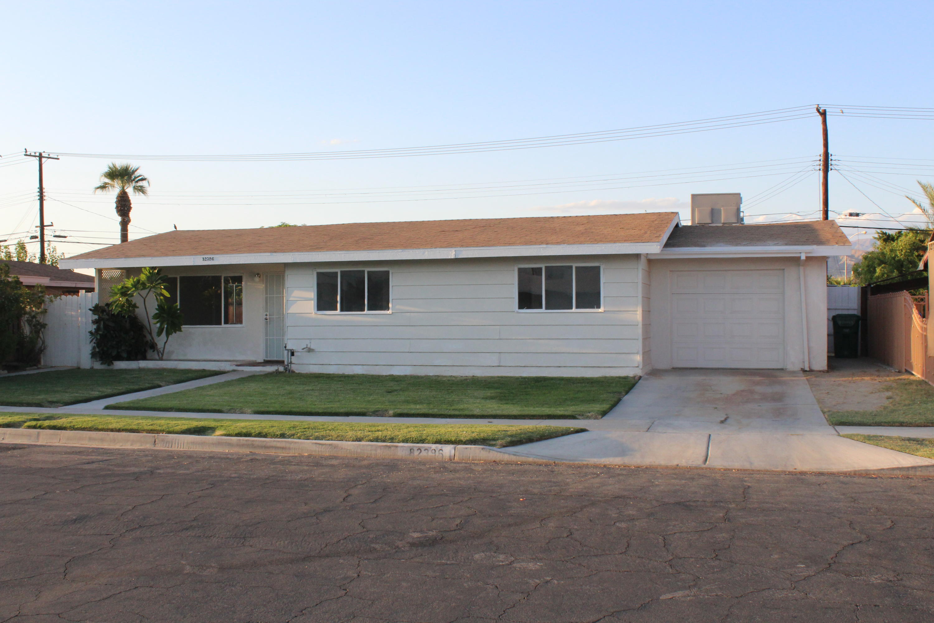 82396 Adobe Road Indio, CA 92201 - Photo 3 of 53 a front view of a house with a yard