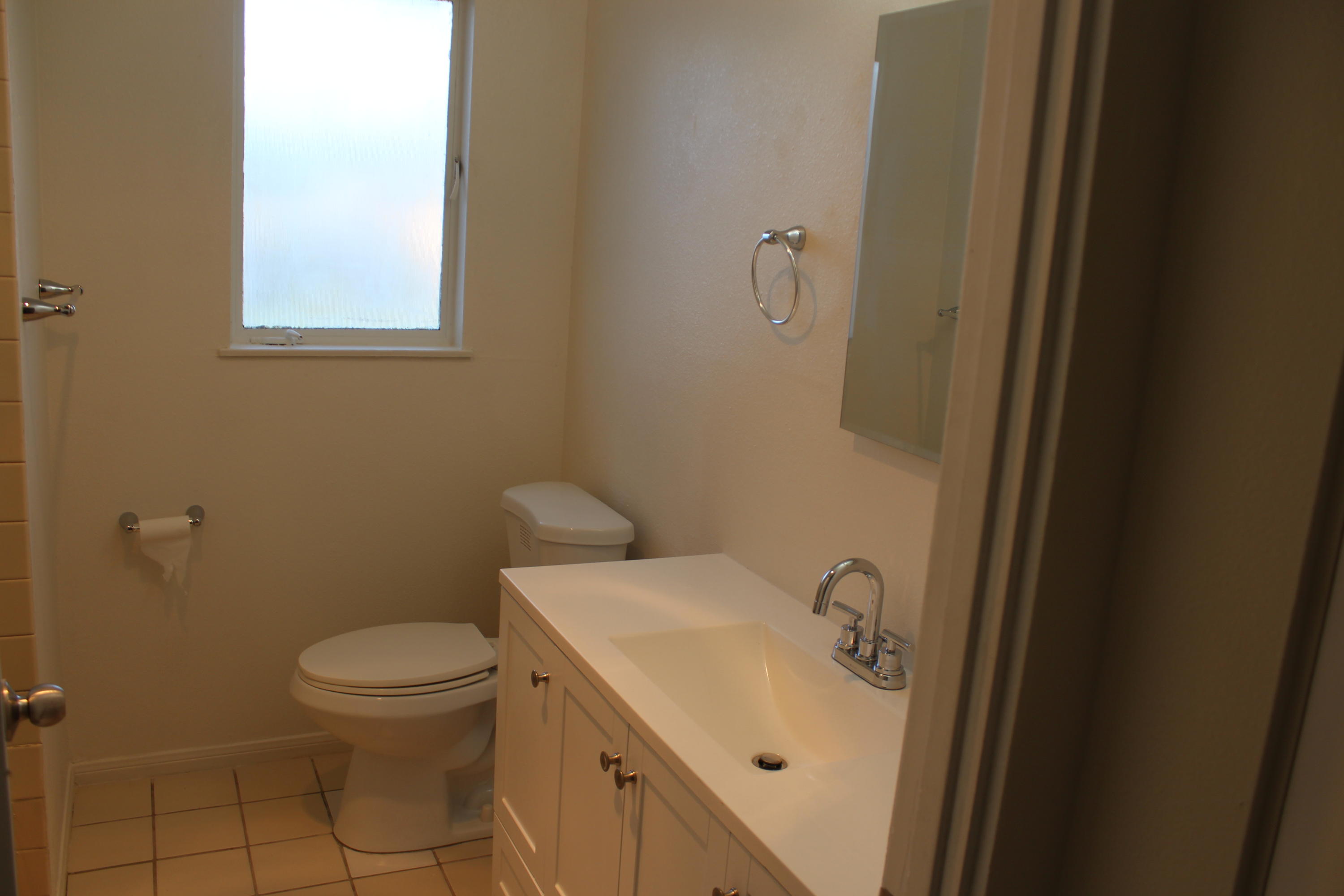 82396 Adobe Road Indio, CA 92201 - Photo 26 of 53 a bathroom with a sink a toilet and a mirror