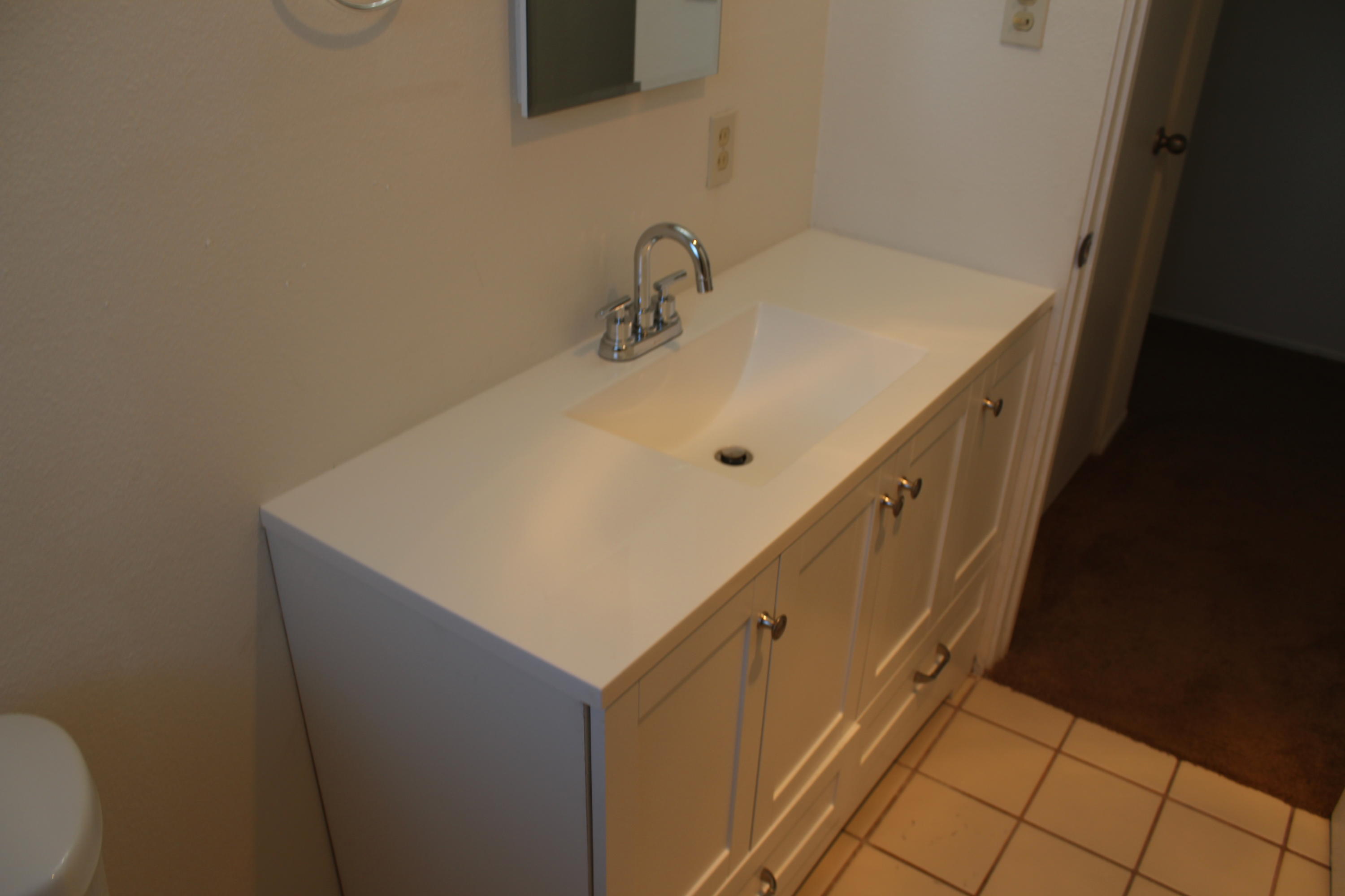 82396 Adobe Road Indio, CA 92201 - Photo 29 of 53 a bathroom with a sink and mirror
