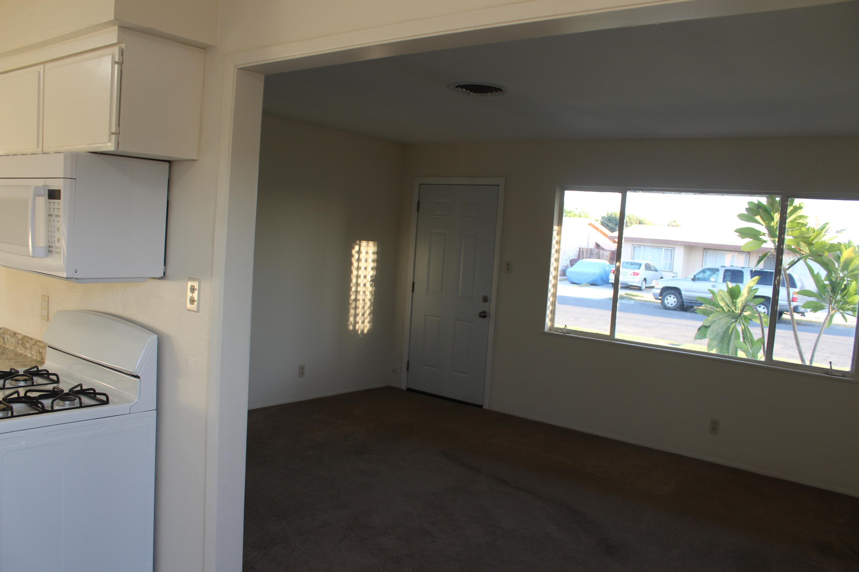 82396 Adobe Road Indio, CA 92201 - Photo 4 of 53 a view of a livingroom with an empty space and a window
