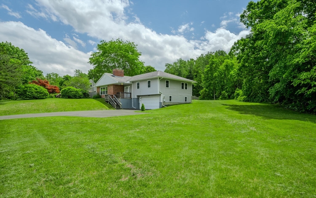 463 Bay Road Amherst, MA 01002 - Photo 2 of 9 a view of an house with backyard and garden