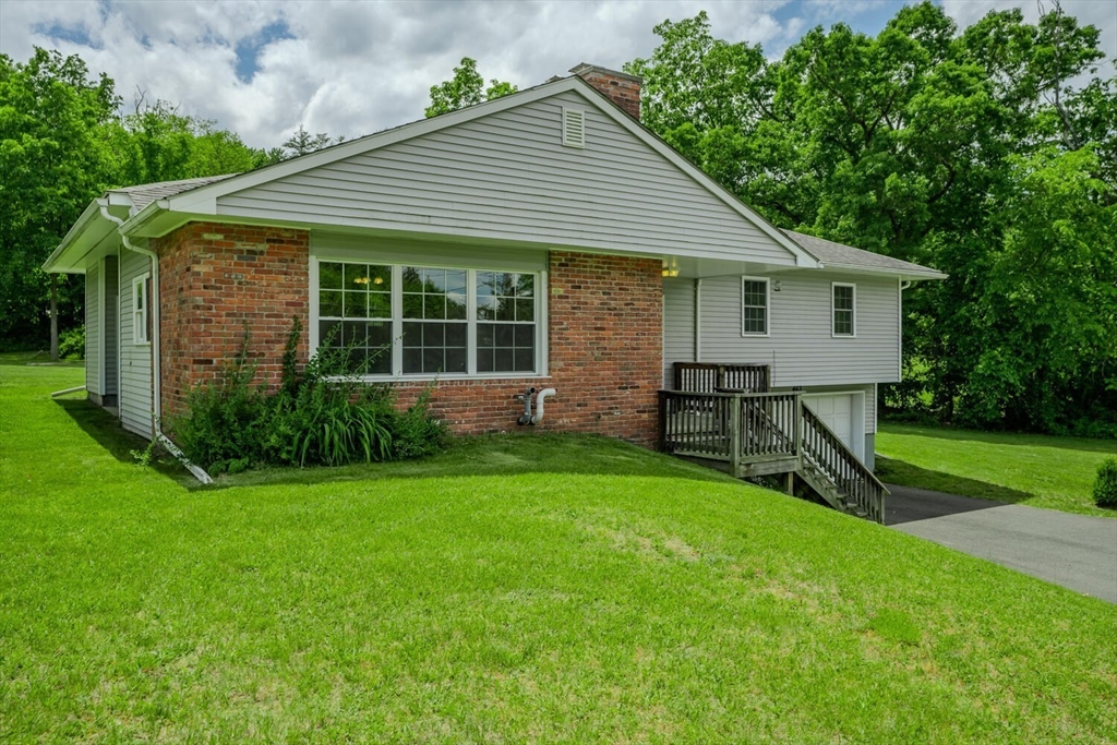 463 Bay Road Amherst, MA 01002 - Photo 4 of 9 a view of a house with backyard and porch