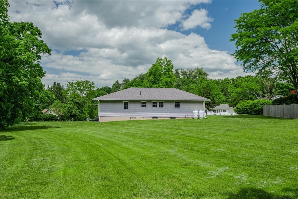 463 Bay Road Amherst, MA 01002 - Photo 5 of 9 a view of a big house with a big yard and large trees