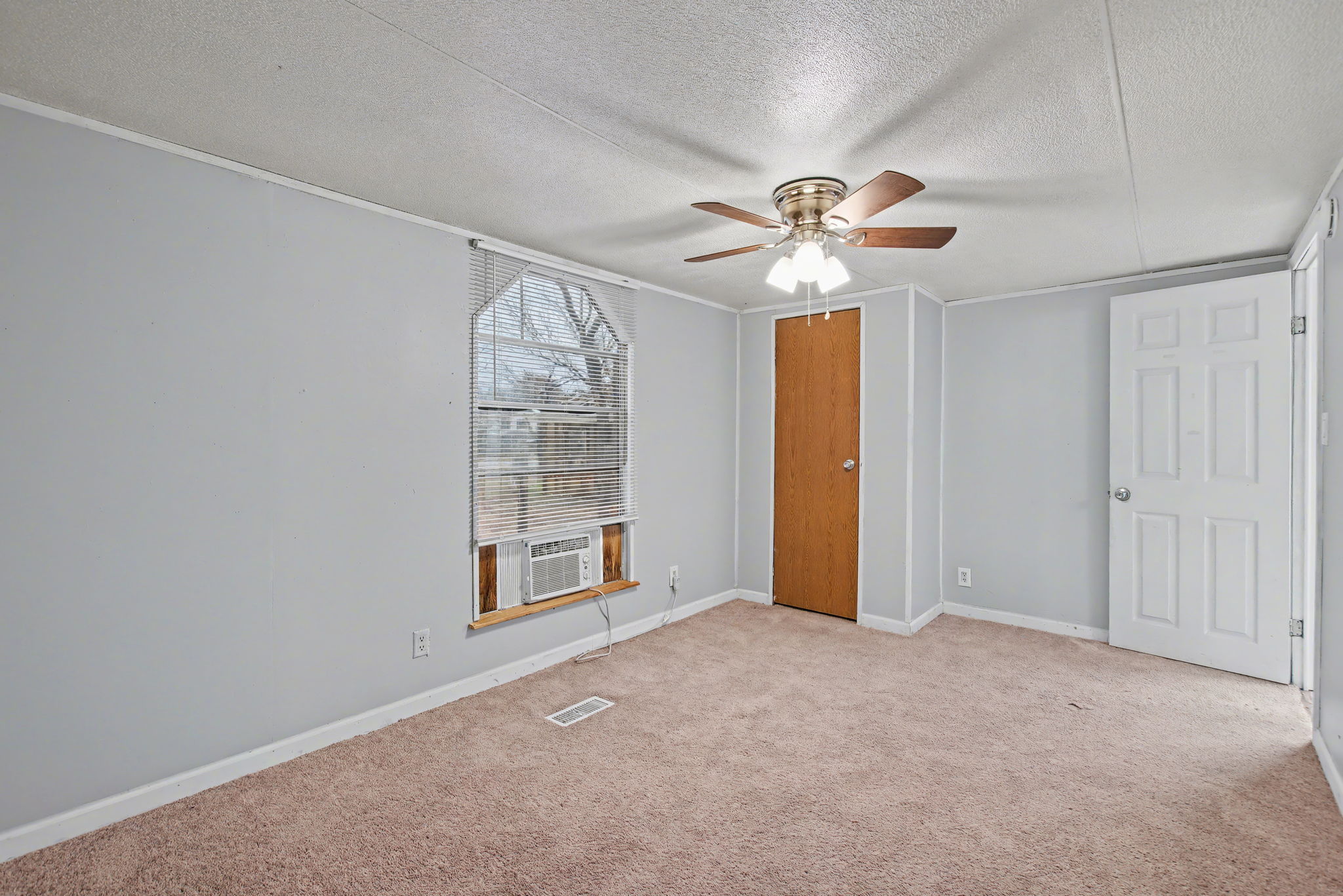 919 Austin Street Kingsland, TX 78639 - Photo 9 of 20 wooden floor in an empty room with a window