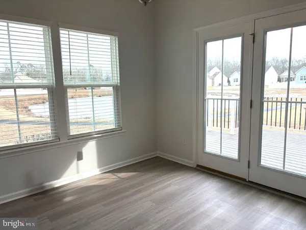 a view of a balcony with wooden floor