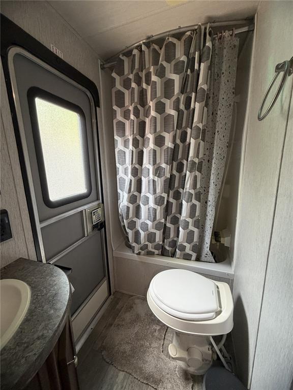 3000 Clarcona Road, Unit 743 Apopka, FL 32703 - Photo 49 of 54 a bathroom with a toilet a sink and a mirror