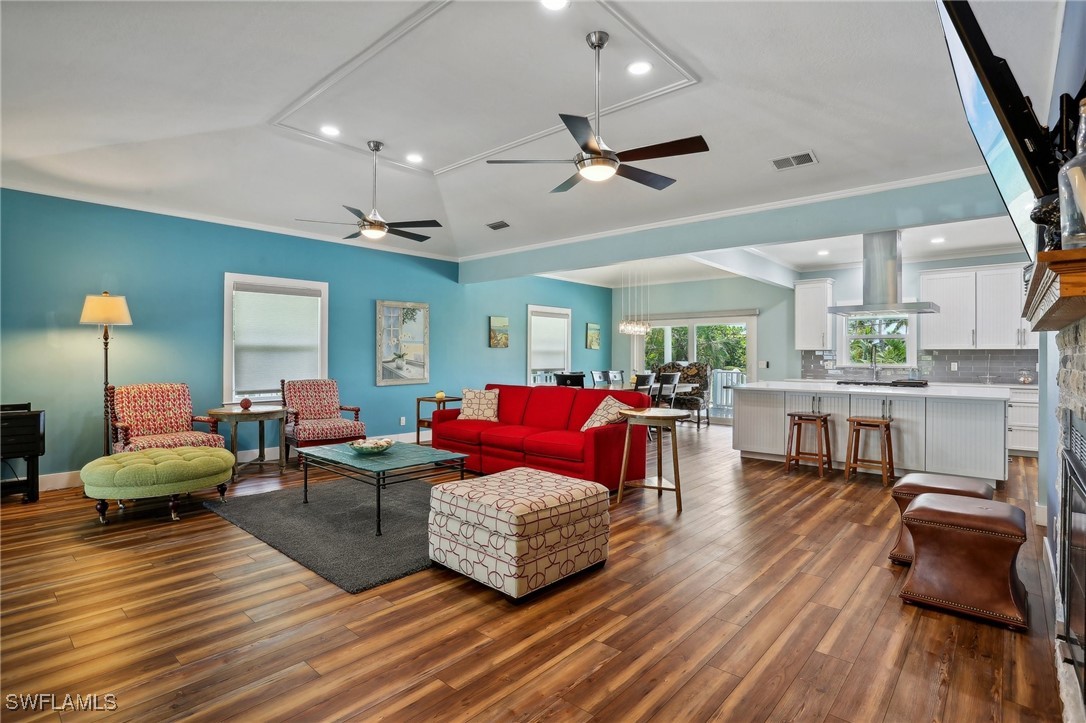 8335 Main Street Bokeelia, FL 33922 - Photo 15 of 47 a living room with furniture and wooden floor
