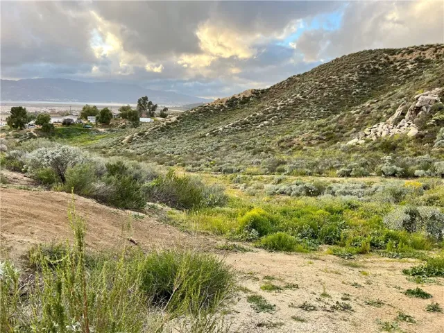 a view of a road with a mountain in the background