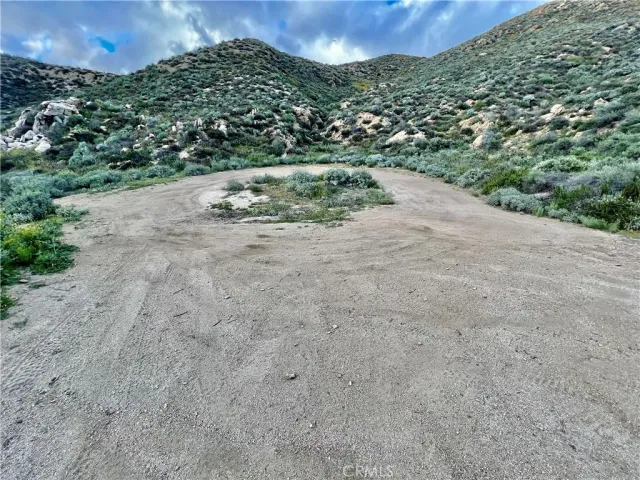 a view of a pathway both side of river with yard in back