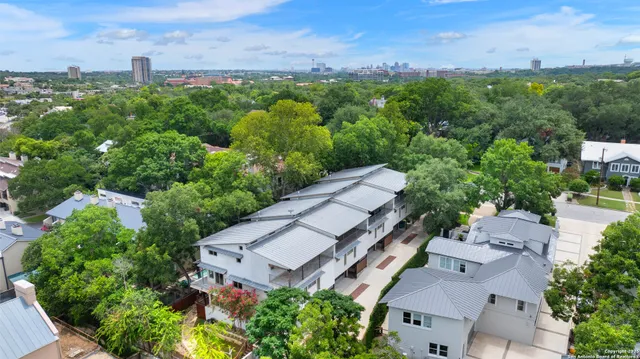 an aerial view of a house with a yard