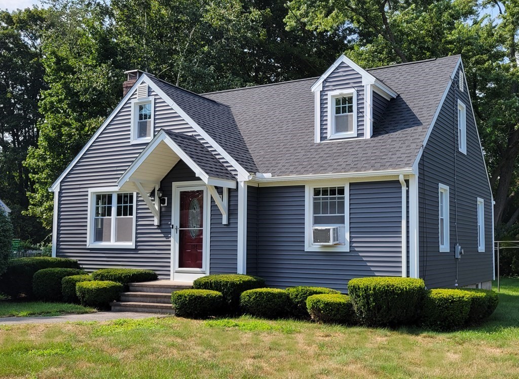 174 Bridge Road Northampton, MA 01062 - Photo 1 of 24 a front view of a house with a yard