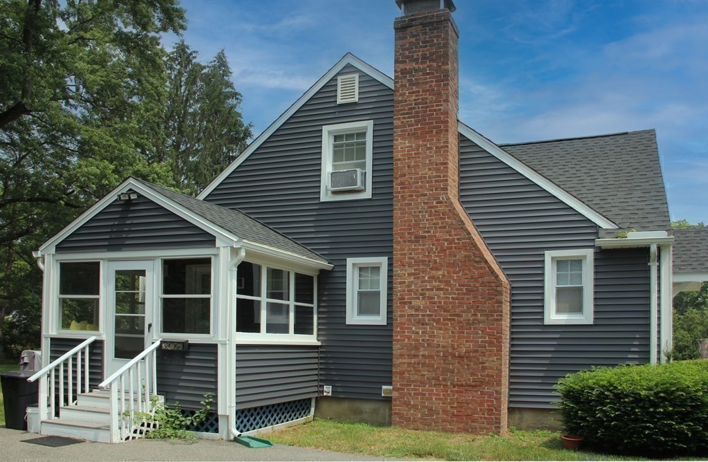 174 Bridge Road Northampton, MA 01062 - Photo 19 of 24 a front view of a house with garden