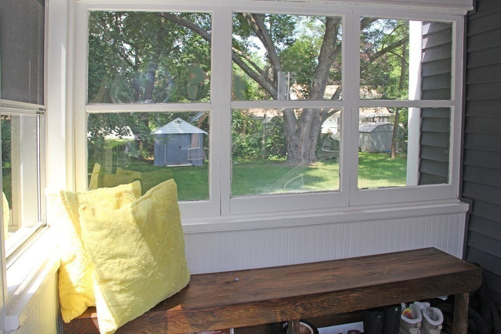 174 Bridge Road Northampton, MA 01062 - Photo 9 of 24 a living room with a table and a floor to ceiling window