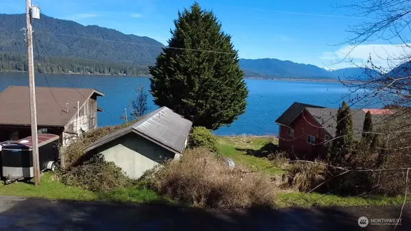 an aerial view of houses with yard