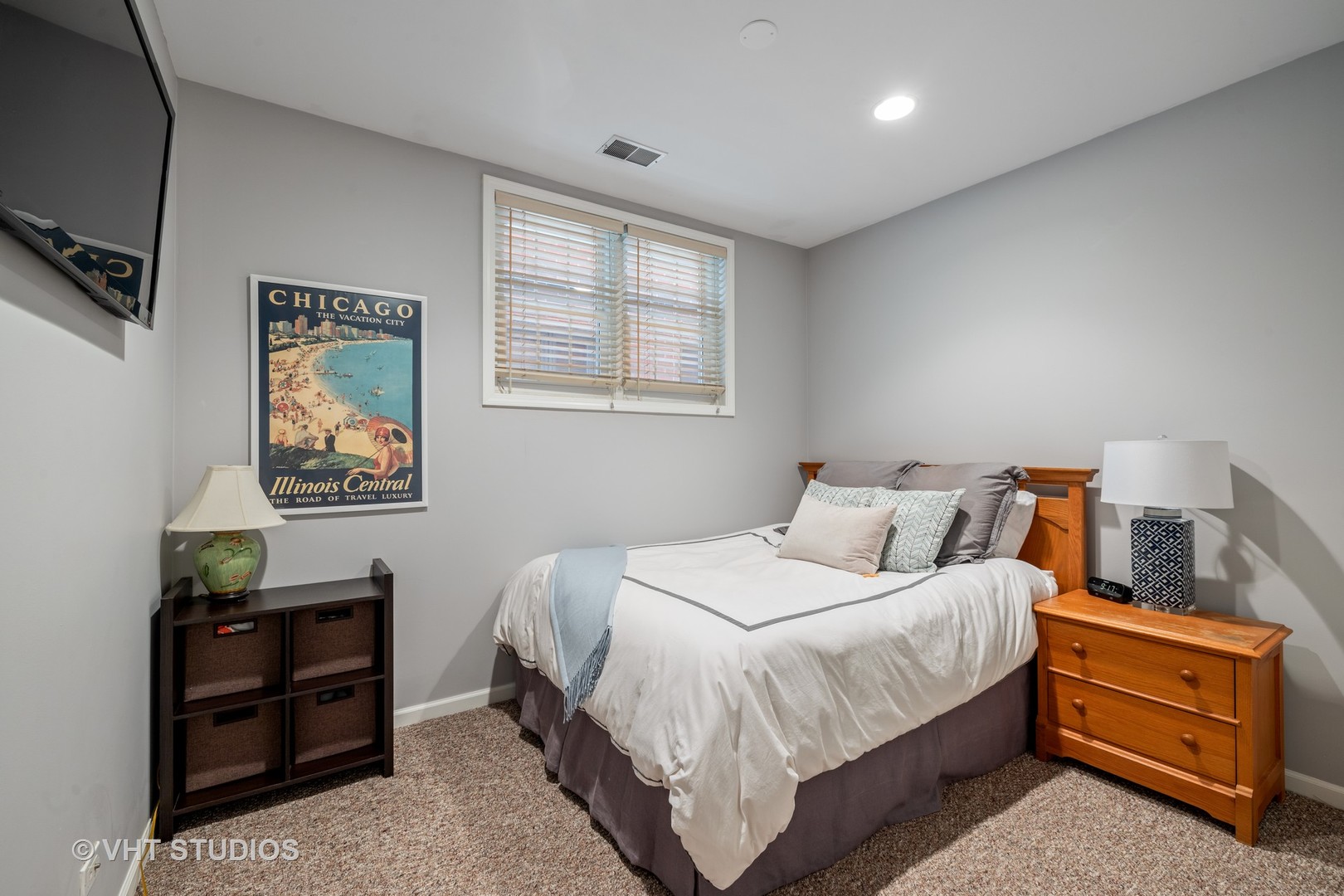 2050 North Racine Avenue, Unit 1 Chicago, IL 60614 - Photo 17 of 25 a bedroom with a bed and a tv on the dresser