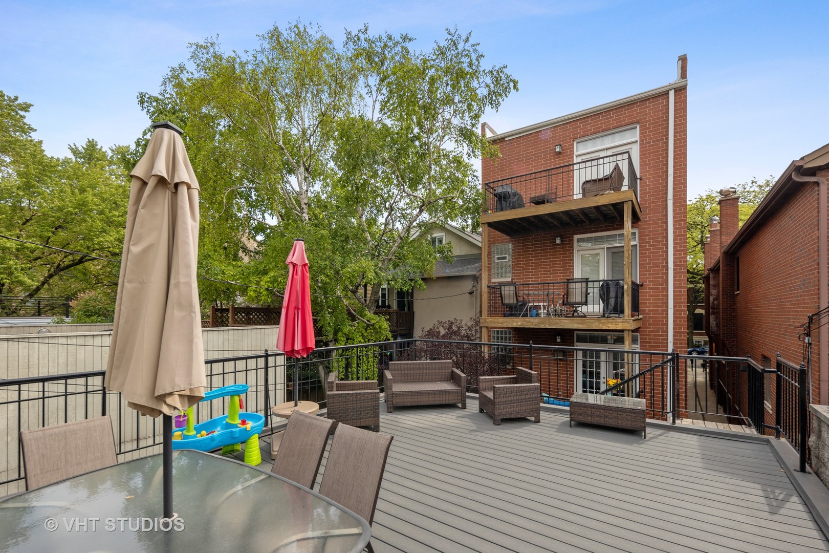2050 North Racine Avenue, Unit 1 Chicago, IL 60614 - Photo 21 of 25 a view of deck with table and chairs and potted plants