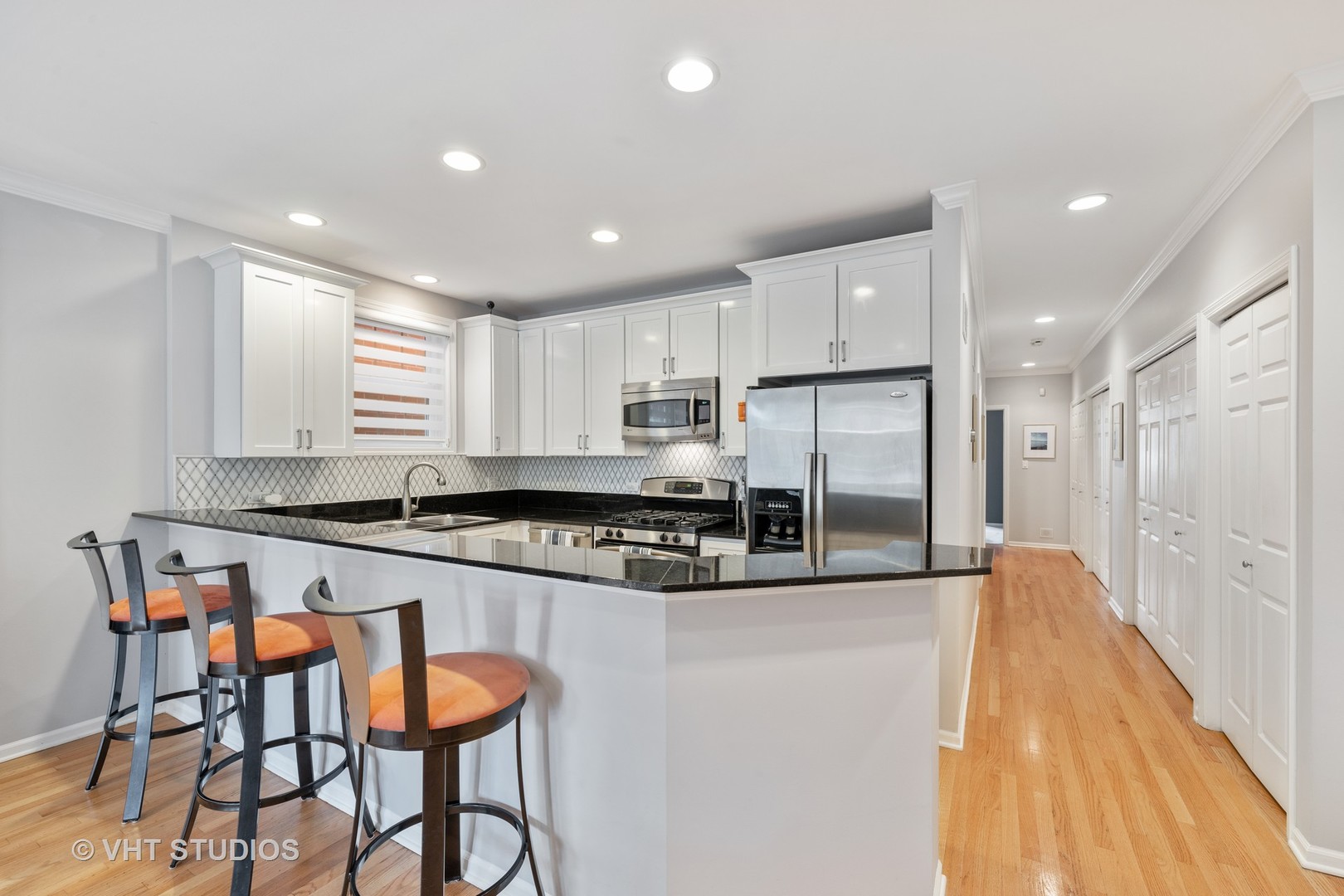 2050 North Racine Avenue, Unit 1 Chicago, IL 60614 - Photo 6 of 25 a kitchen with stainless steel appliances granite countertop a stove a sink and a refrigerator