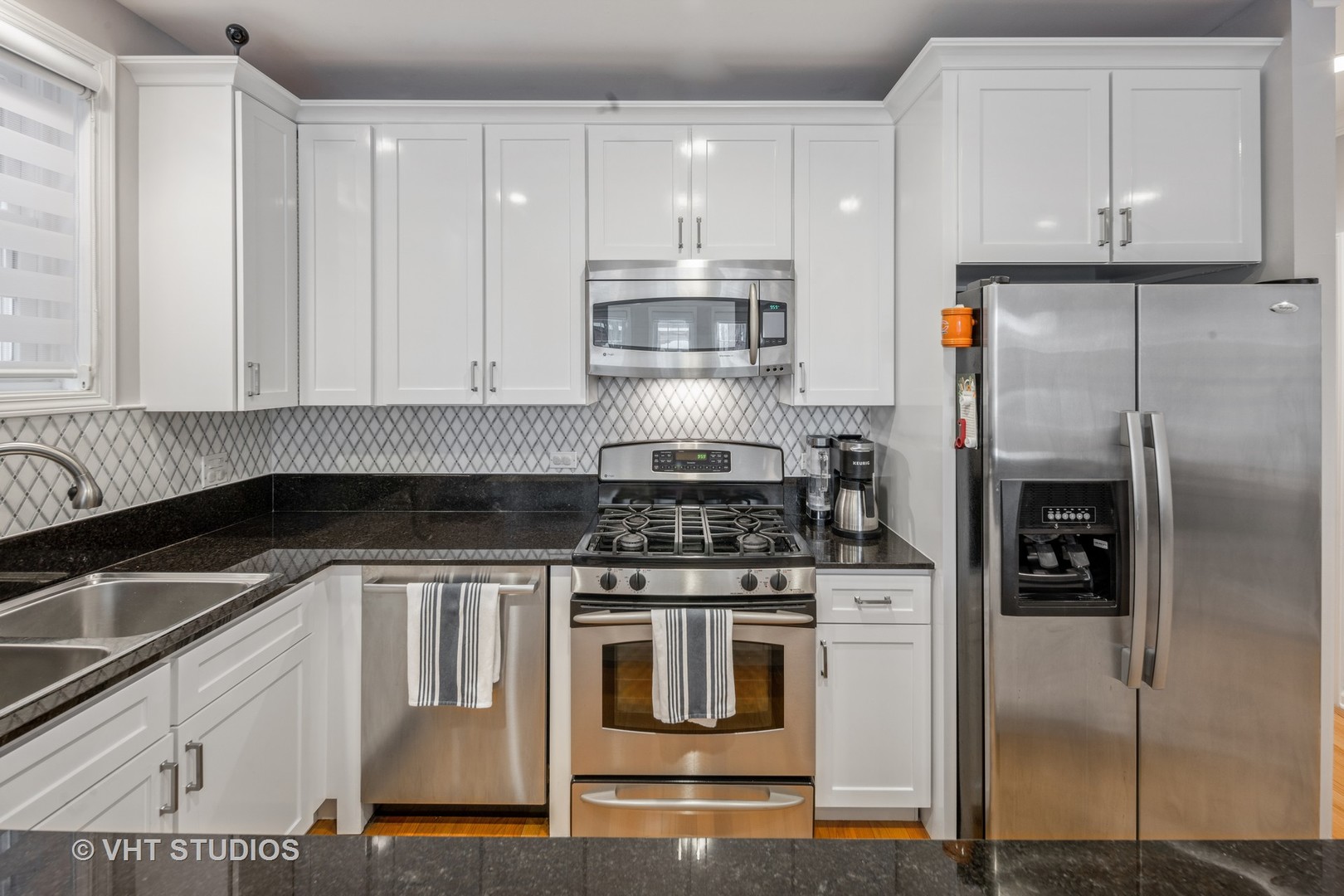 2050 North Racine Avenue, Unit 1 Chicago, IL 60614 - Photo 7 of 25 a kitchen with a stove and a refrigerator