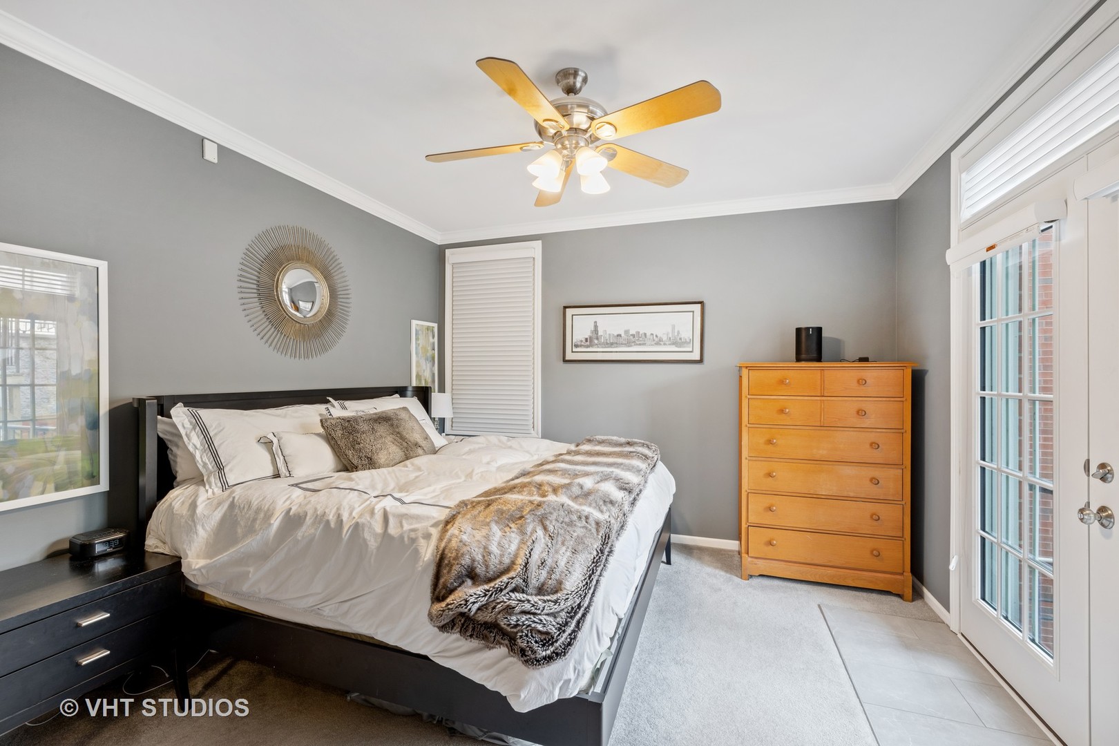 2050 North Racine Avenue, Unit 1 Chicago, IL 60614 - Photo 8 of 25 a bedroom with a bed and a ceiling fan