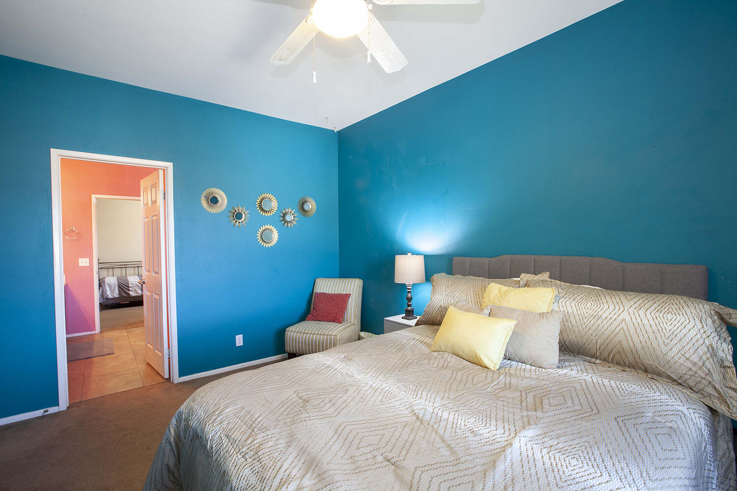 43500 Brahea Court Indio, CA 92201 - Photo 19 of 33 a bedroom with a bed and a chandelier