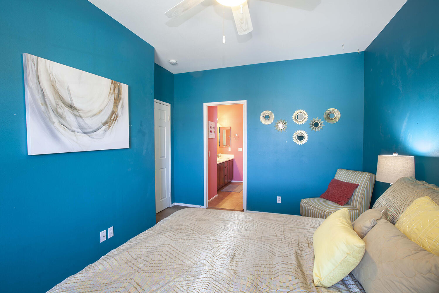 43500 Brahea Court Indio, CA 92201 - Photo 20 of 33 a bedroom with a bed and a lamp