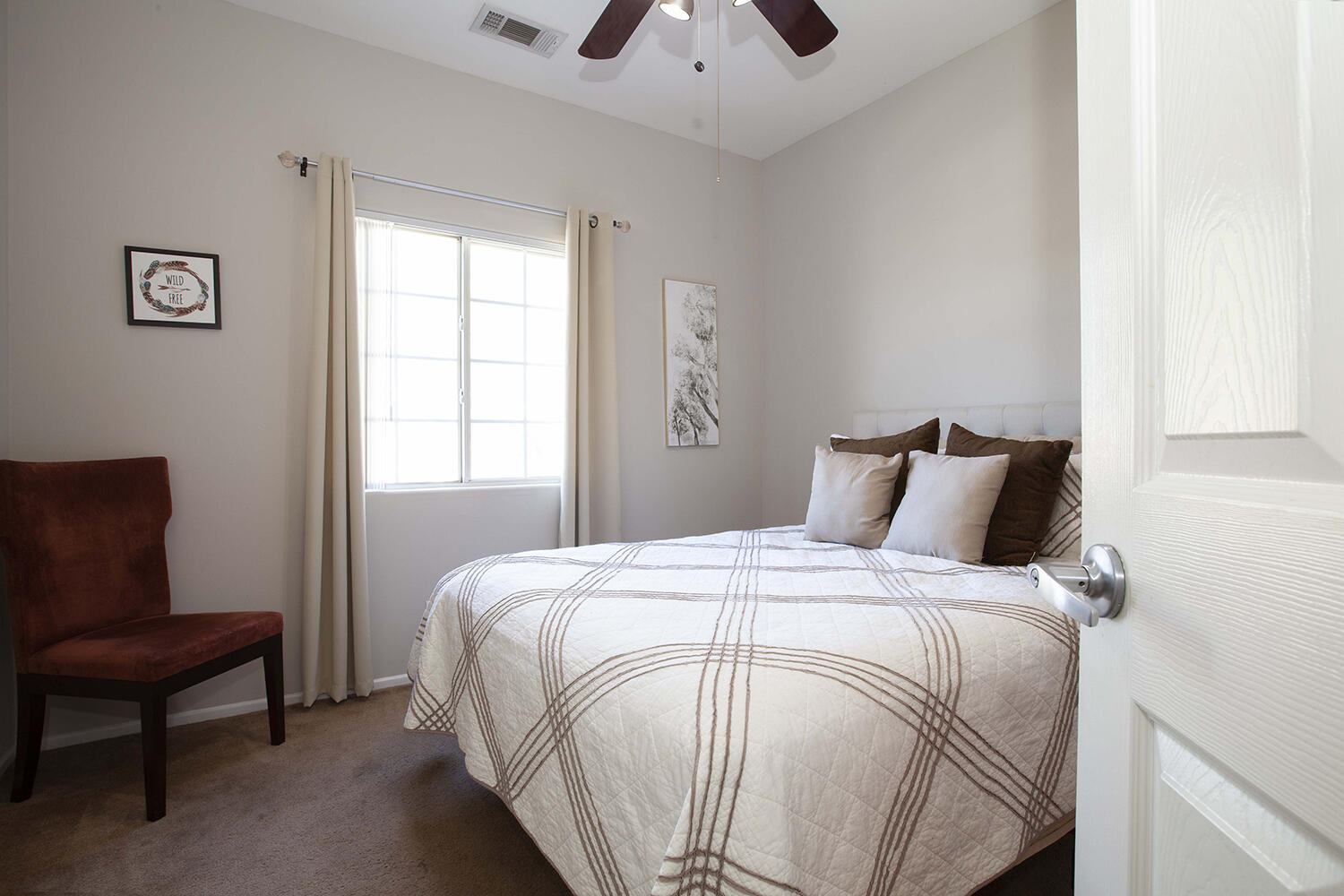 43500 Brahea Court Indio, CA 92201 - Photo 23 of 33 a bedroom with a bed and chair