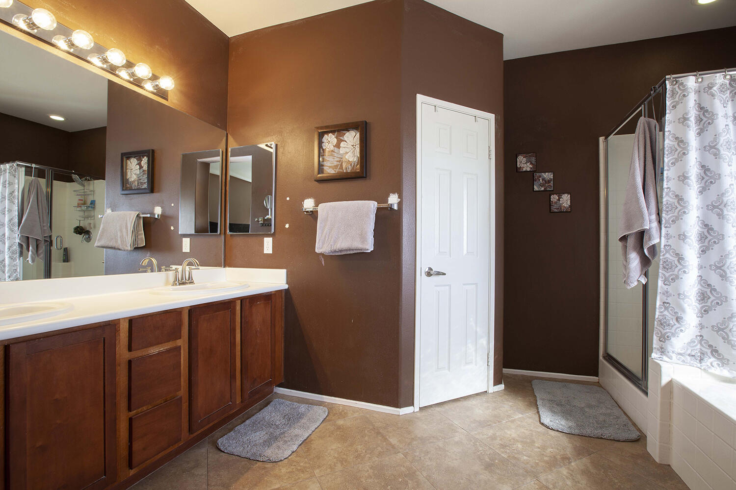 43500 Brahea Court Indio, CA 92201 - Photo 28 of 33 a spacious bathroom with a shower sink and mirror
