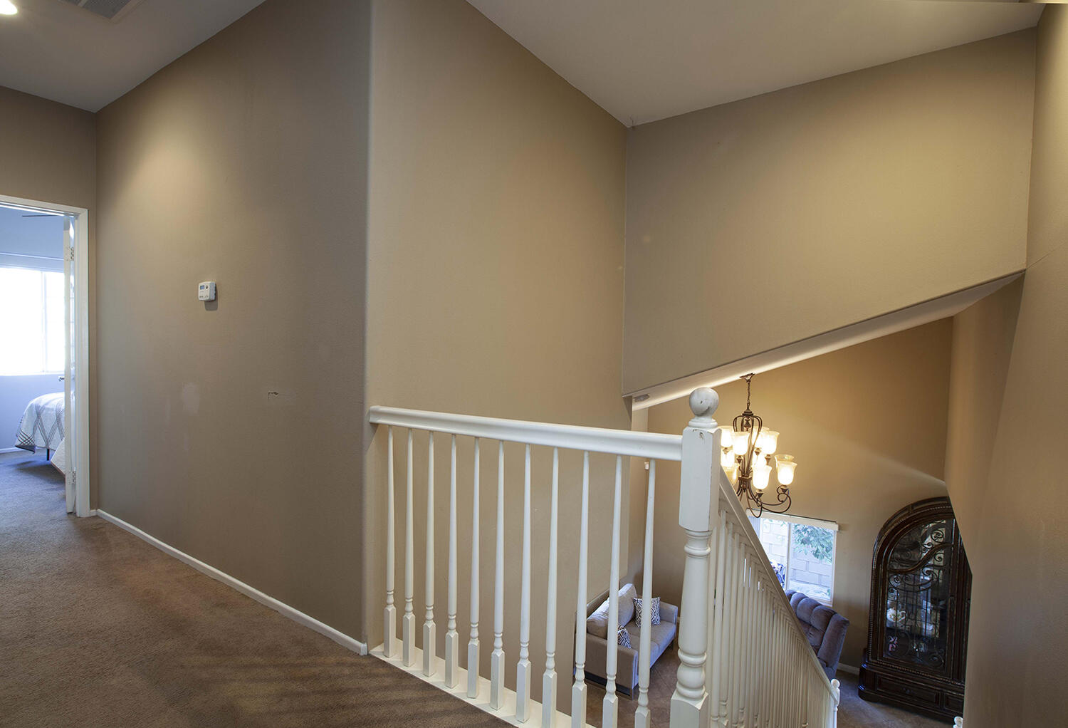 43500 Brahea Court Indio, CA 92201 - Photo 29 of 33 a view of a hallway to a livingroom with entryway and stairs