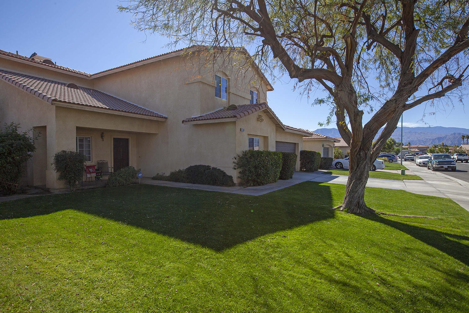 43500 Brahea Court Indio, CA 92201 - Photo 3 of 33 a front view of a house with garden