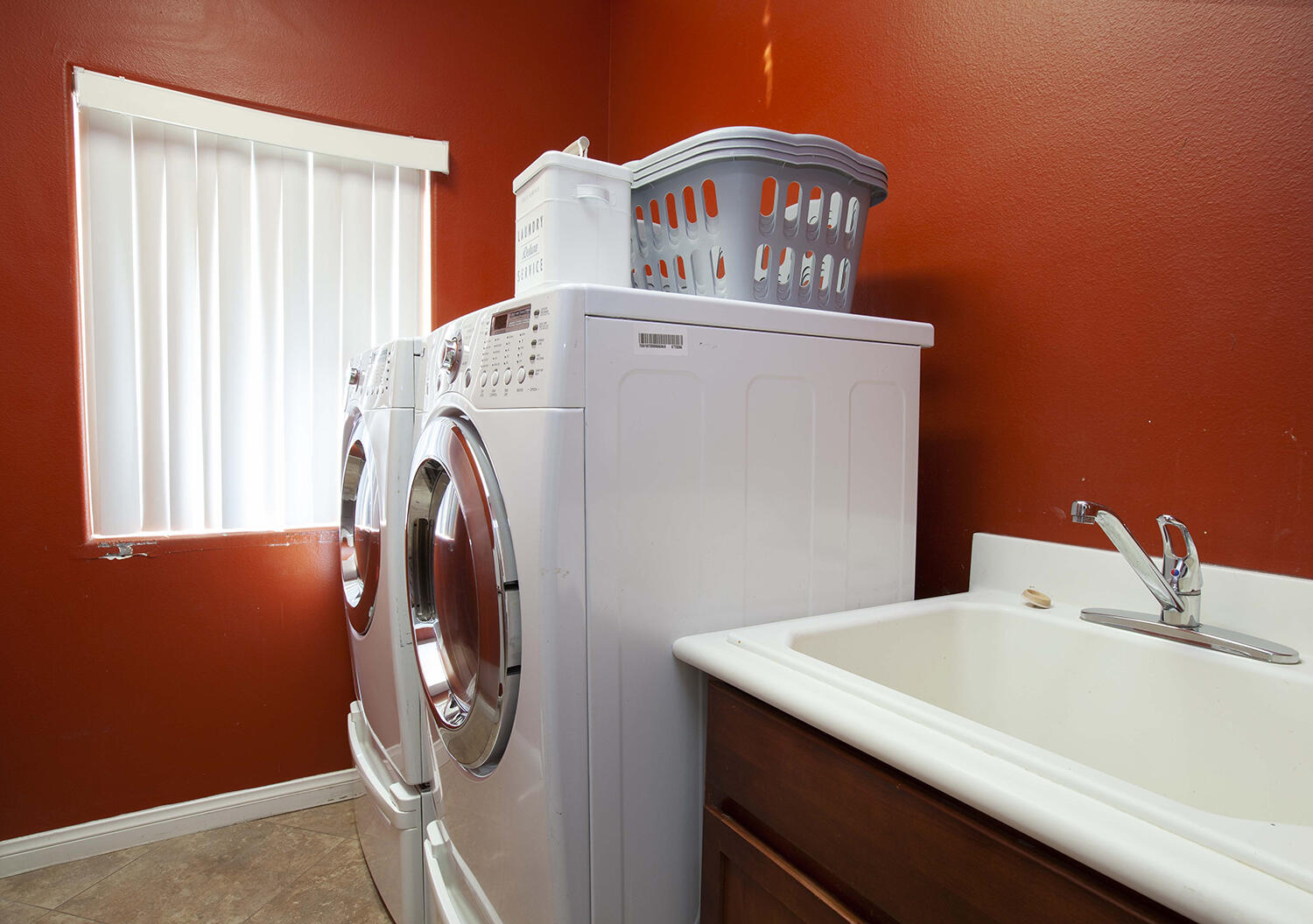 43500 Brahea Court Indio, CA 92201 - Photo 33 of 33 a view of washer and dryer with kitchen in the background