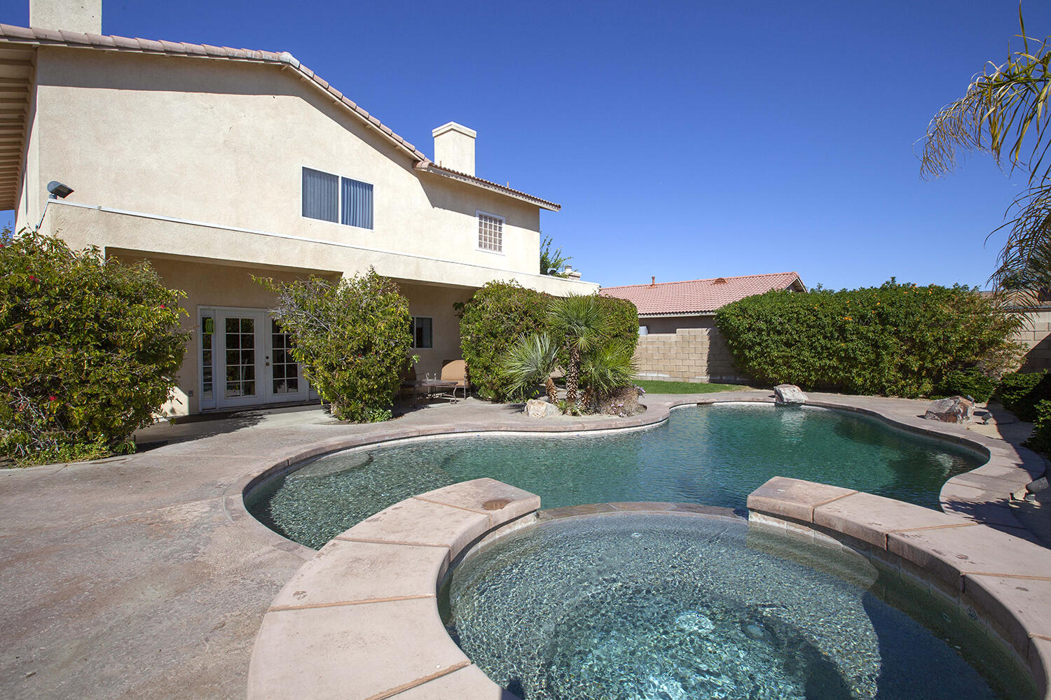 43500 Brahea Court Indio, CA 92201 - Photo 6 of 33 a front view of a house with garden