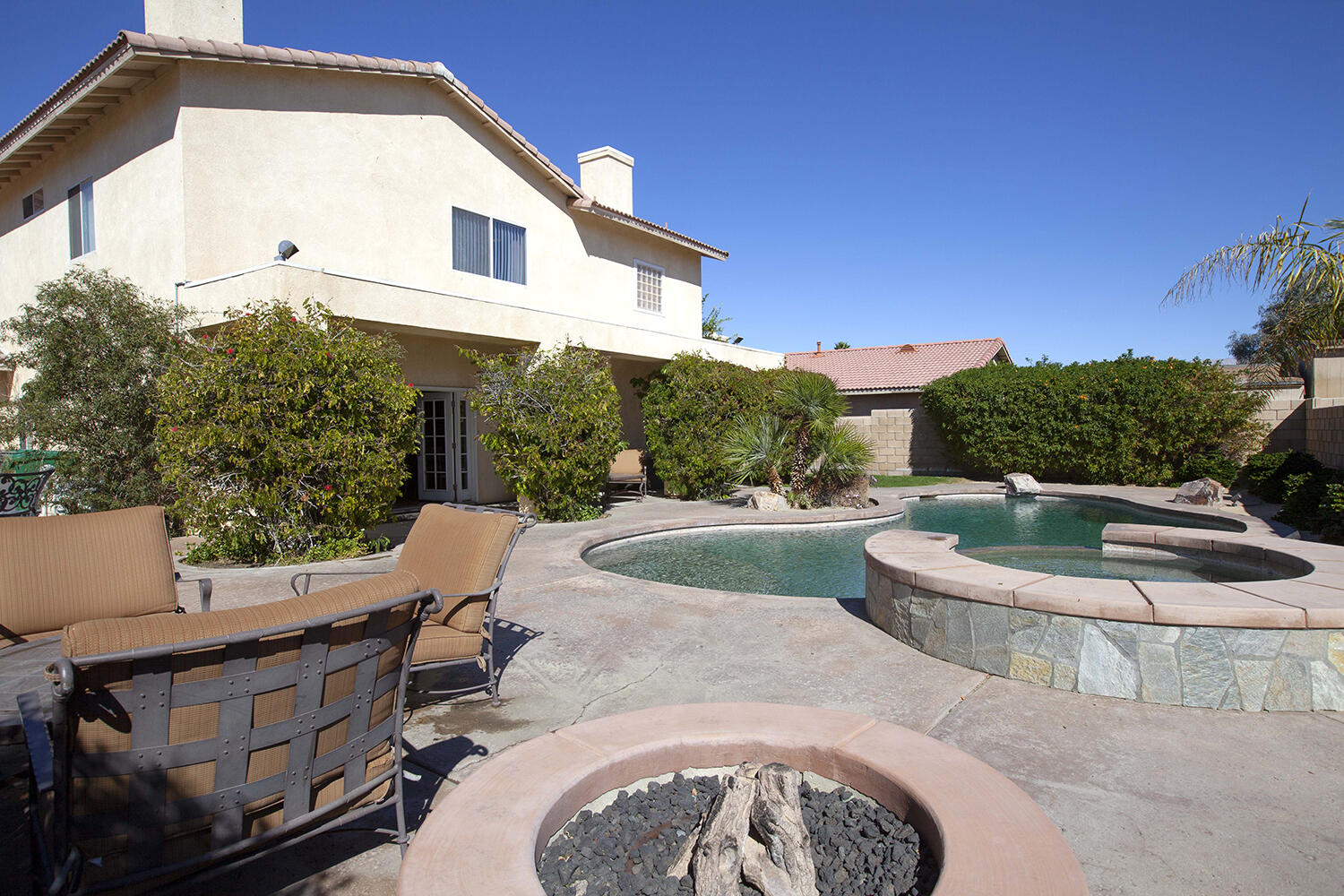 43500 Brahea Court Indio, CA 92201 - Photo 7 of 33 a view of a patio with a table and chairs