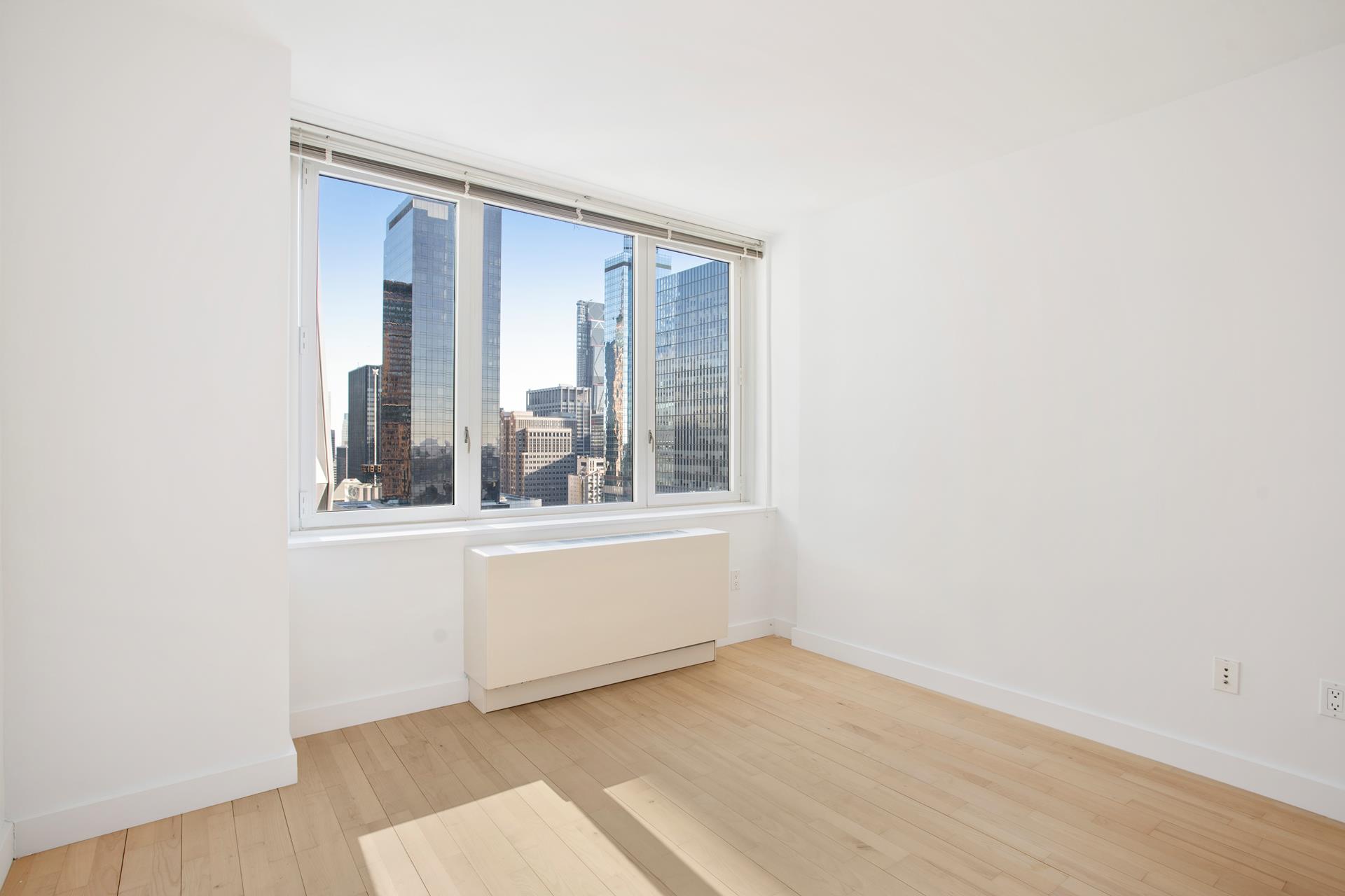 322 West 57th Street, Unit 55S1 Manhattan, NY 10019 - Photo 16 of 33 a view of an empty room with window