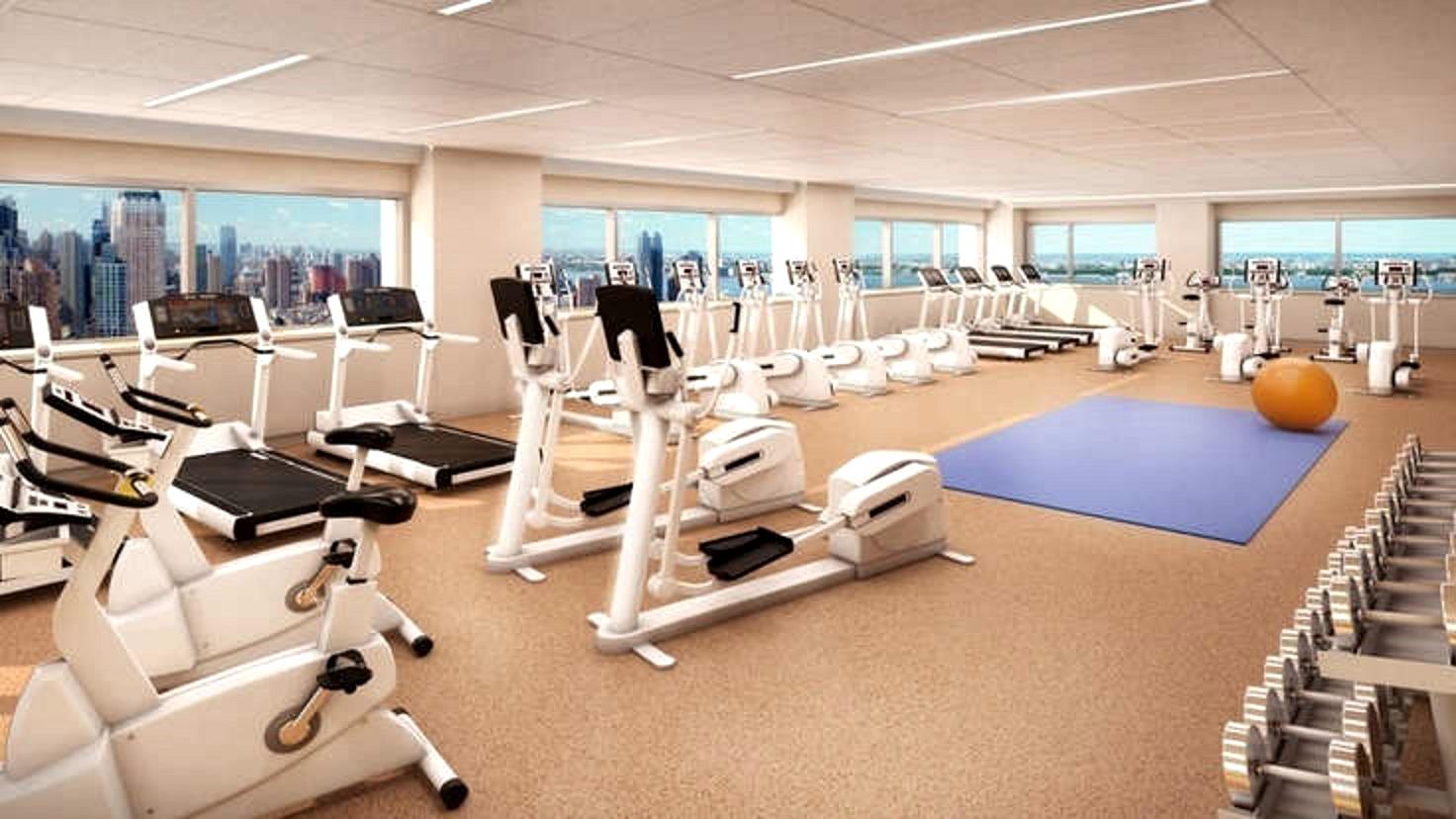 322 West 57th Street, Unit 55S1 Manhattan, NY 10019 - Photo 28 of 33 a room with gym equipment and view of living room
