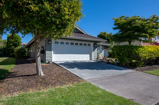 a front view of a house with garden