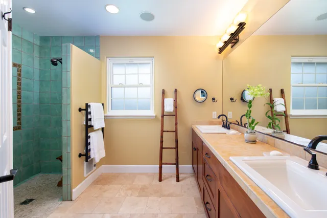 a bathroom with a sink and mirror