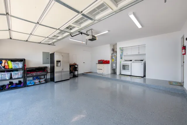 a view of a garage with furniture and a garage