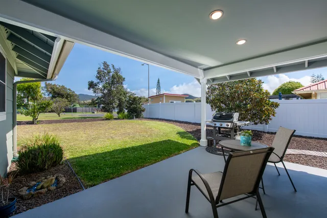 a view of yard with patio