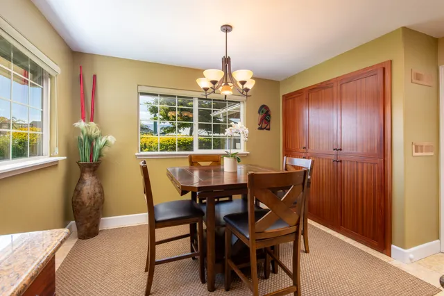 a dining room with furniture and window