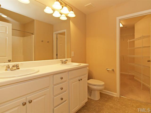 7122 Racine Way Raleigh, NC 27615 - Photo 11 of 20 The master bath has a double vanity, garden tub/shower, and a large walk-in closet.
