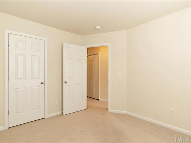 7122 Racine Way Raleigh, NC 27615 - Photo 13 of 20 The two secondary bedrooms are each a nice size with plenty of closet space.
