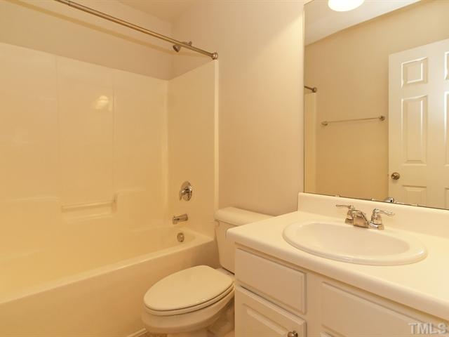 7122 Racine Way Raleigh, NC 27615 - Photo 15 of 20 The secondary full bath has a single vanity and a tub/shower.