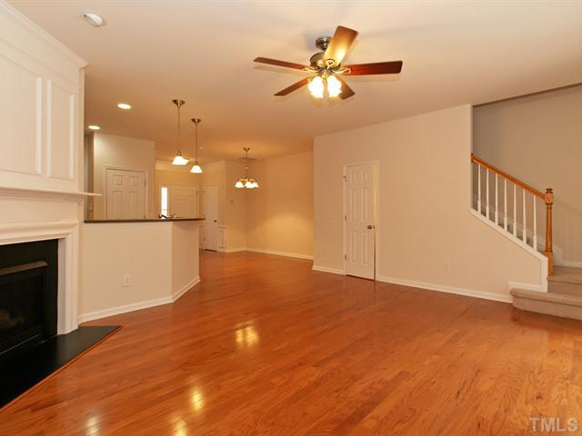 7122 Racine Way Raleigh, NC 27615 - Photo 8 of 20 Gleaming hardwoods ground this open living space.