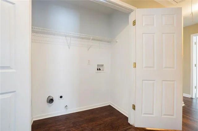 a view of a small space with wooden floor